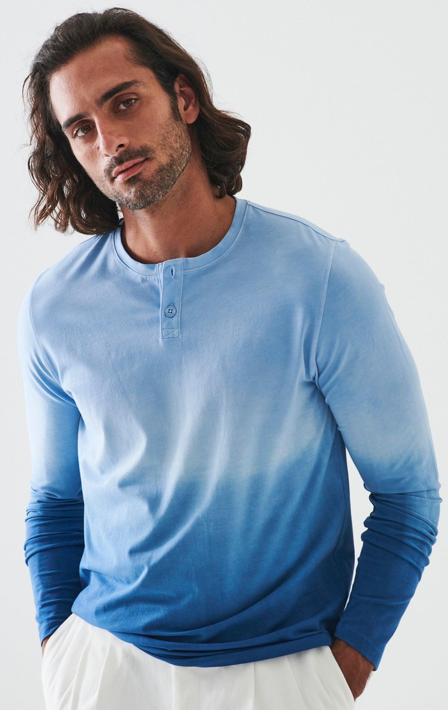 The ultimate in comfort and softness, this long sleeve cotton henly model sports a fine contemporary style. The soft blue combined with darker blues are washed for a soft, cool look. Soft pima cotton. Designed by Assaraf Italy. Button closure henly type collar. Open sleeves and bottom. Modern fit, perfect for a slim to medium build.